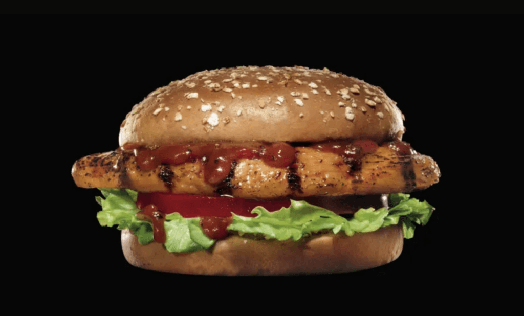 Carl's Jr charbroiled BBQ chicken sandwich, black background